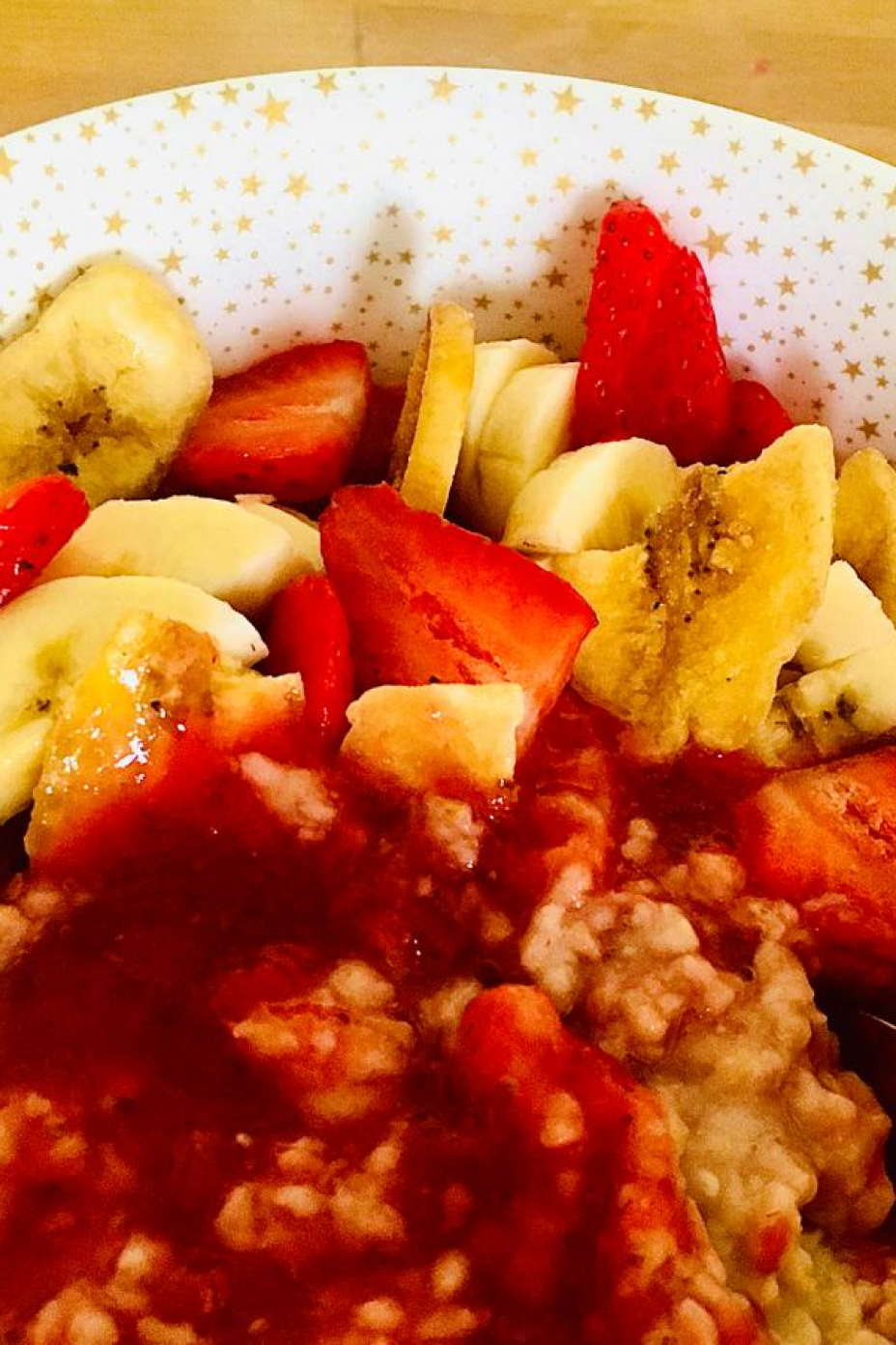 A bowl of strawberry and banana sunrise porridge