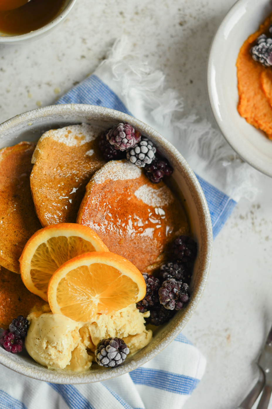 Pumpkin spice pancakes with orange syrup, so tasty. The perfect lazy day breakfast or brunch